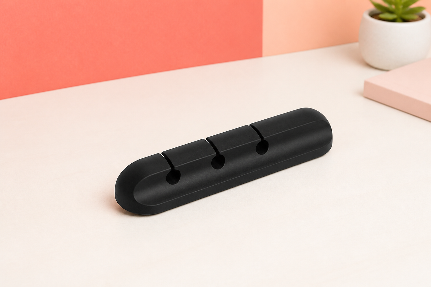 Black CordCove cable organizer with exactly three slots