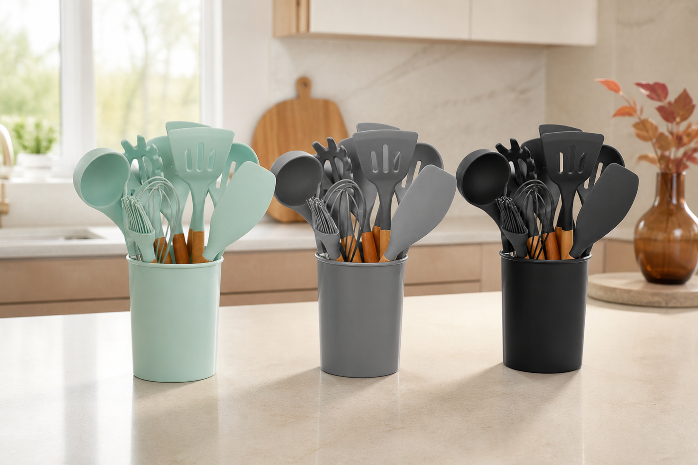 Hearth silicone utensil sets in Sage Green, Grey and Black on a bright kitchen island