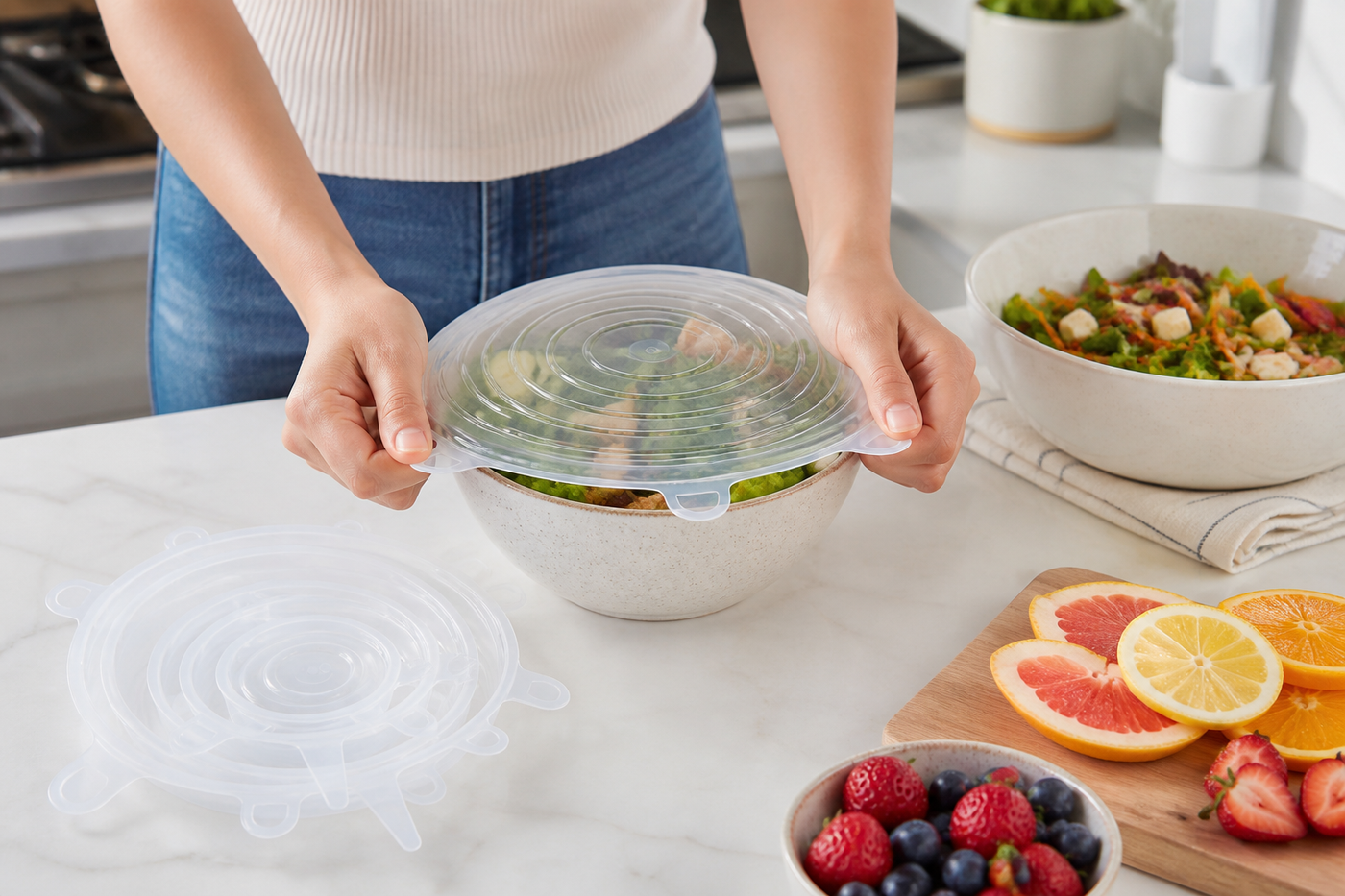 Clear Snug silicone lid stretching evenly over a serving bowl