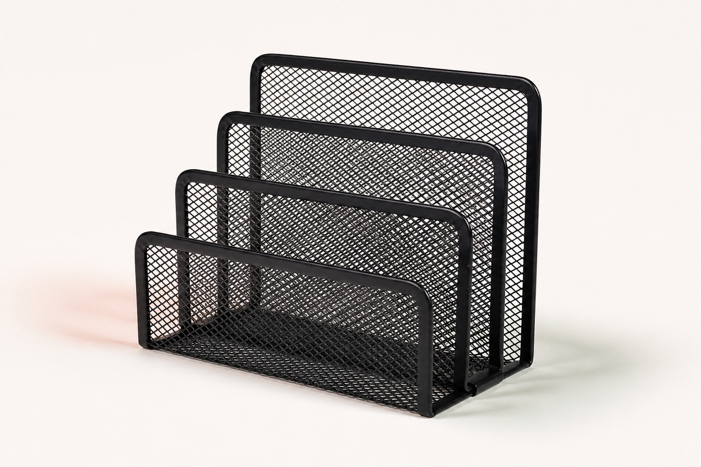 Empty SortRise four-slot black metal mesh file organizer on a clean studio surface
