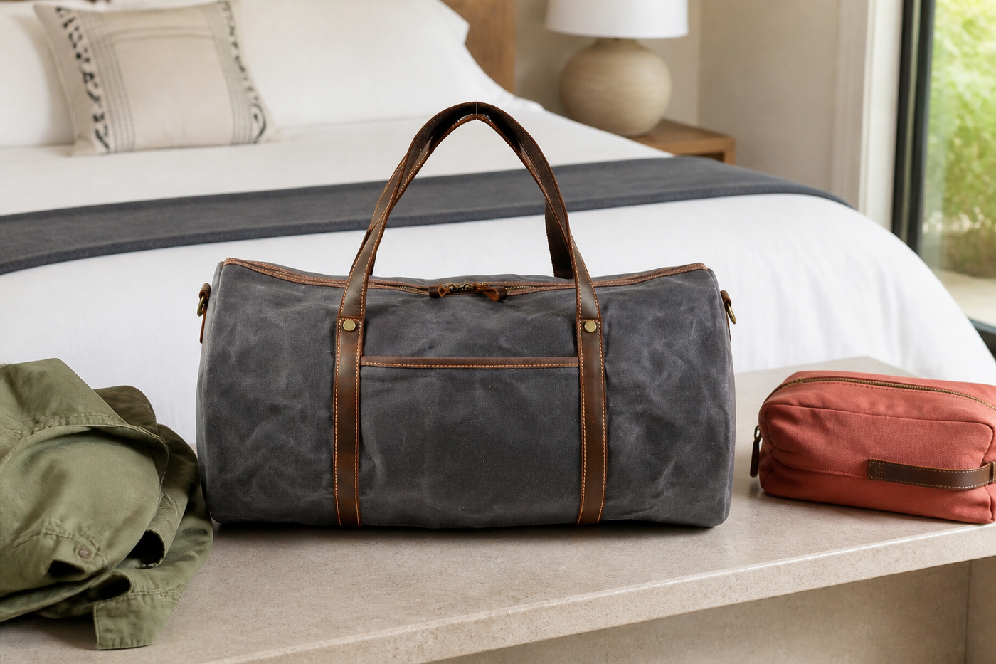 Dark grey Wayfarer canvas weekender duffel in a bright guest room