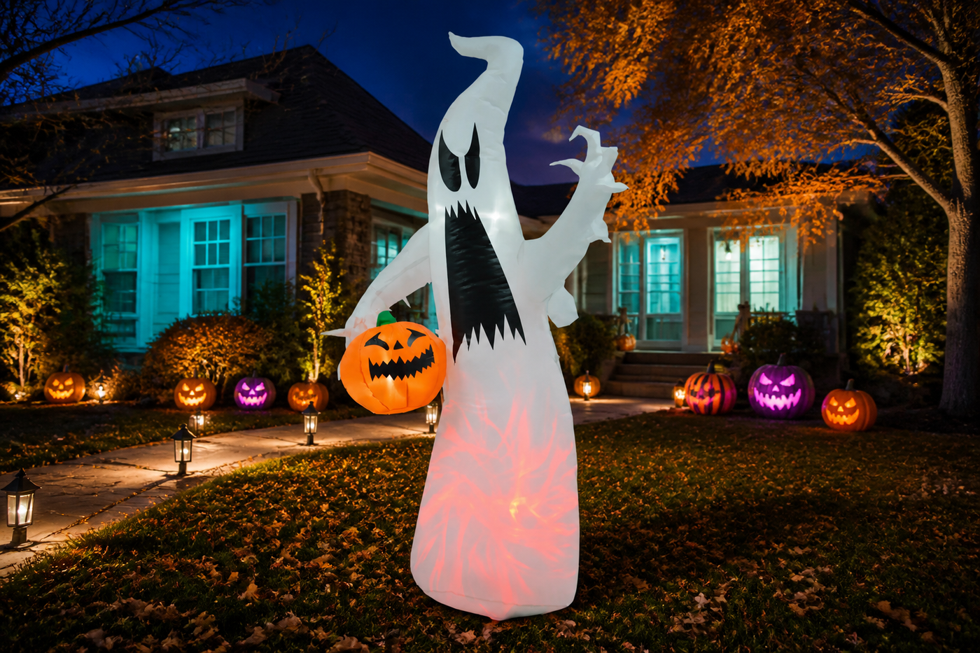 WraithGlow lighted ghost inflatable glowing white and red in a colorful Halloween yard at night