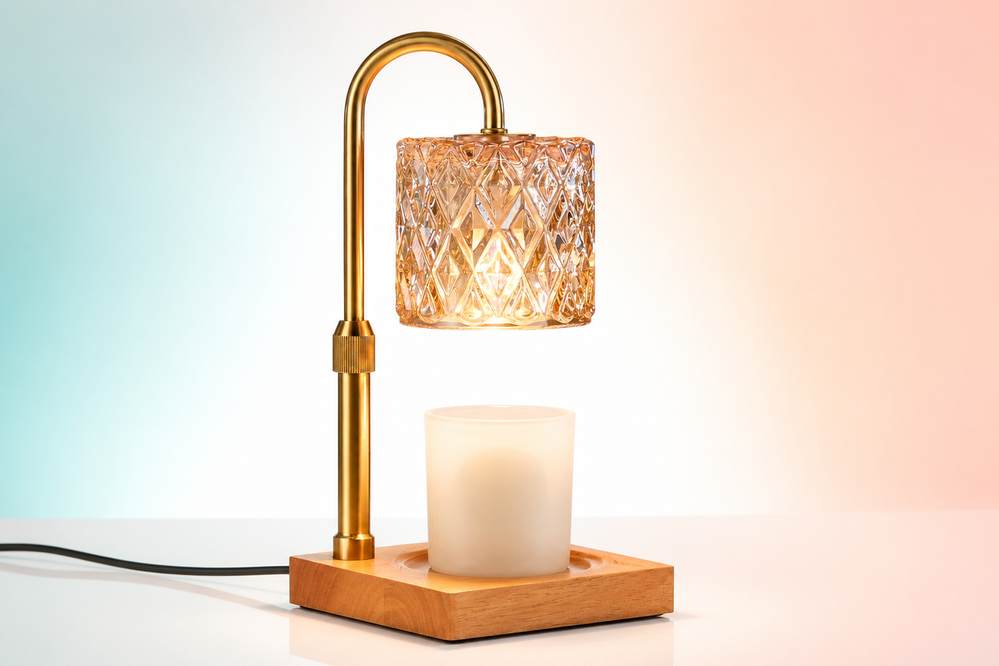 AuraMelt gold arch, square wood base and faceted amber shade in a bright studio