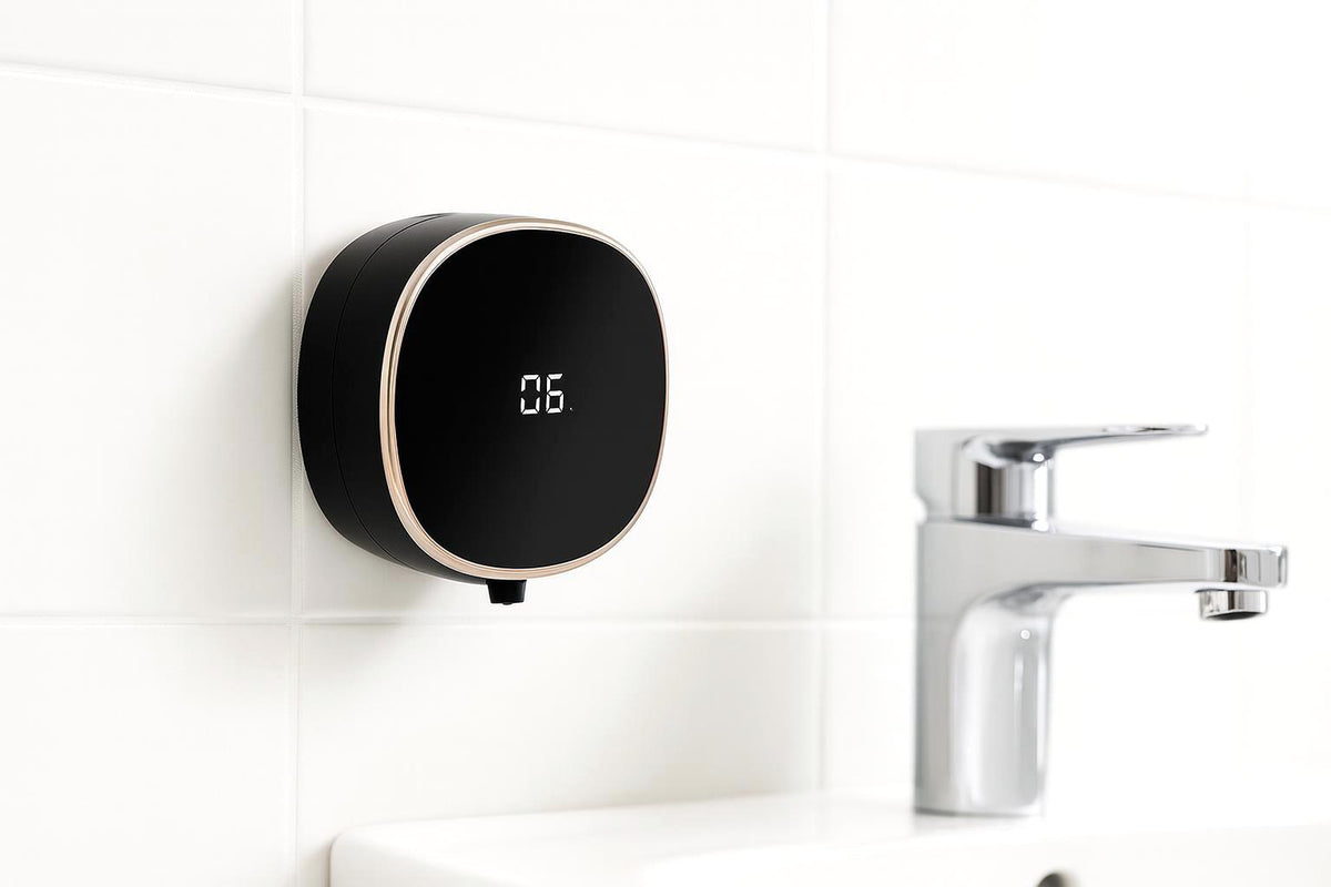 Black PalmSense wall-mounted dispenser beside a bright household basin