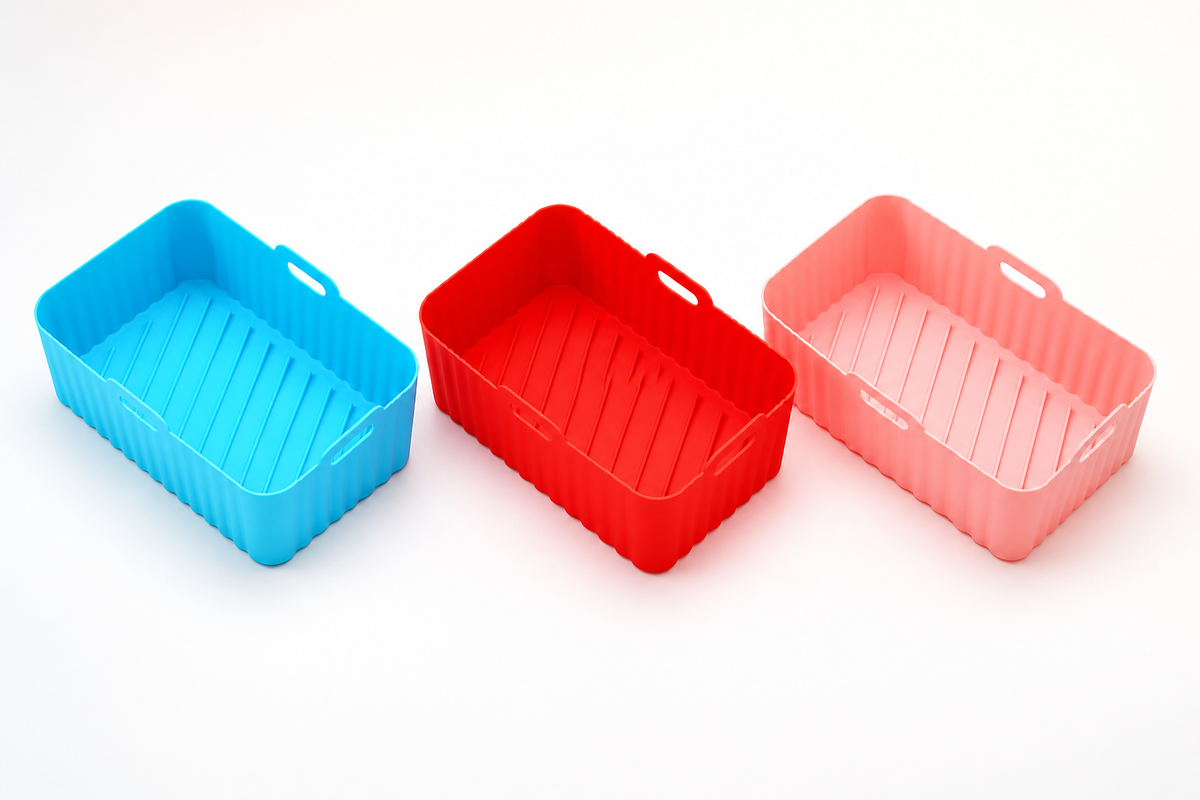 CrispNest silicone air-fryer liners in Blue, Red, and Pink
