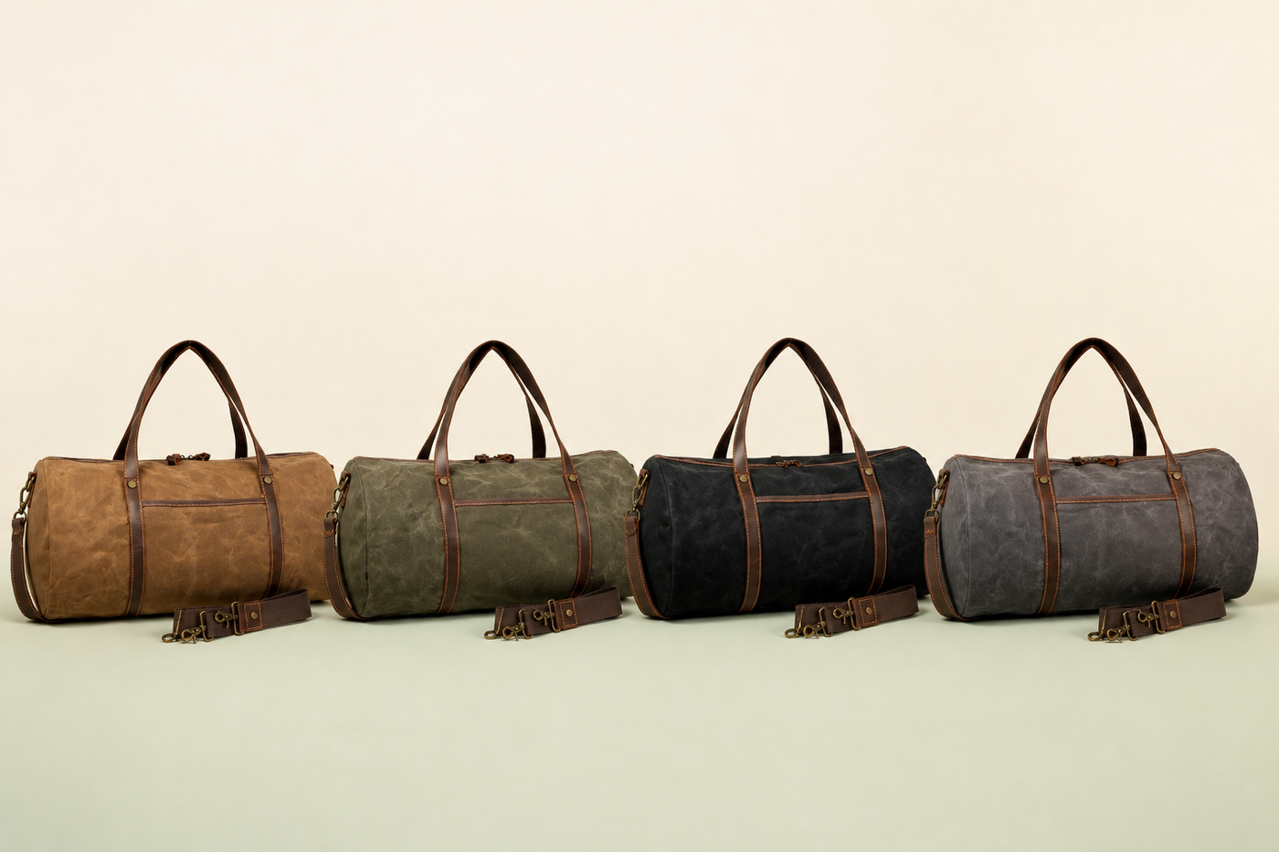 Wayfarer weekender duffels in khaki, green, black, and dark grey on a clean studio background