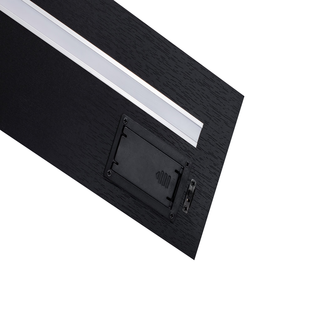Underside of a Halo shelf showing the recessed LED strip, battery compartment and switch