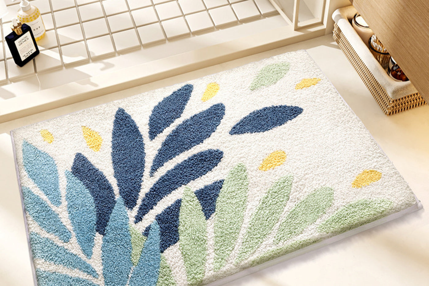 Coastal Botanical Drift bath mat with blue and green leaves