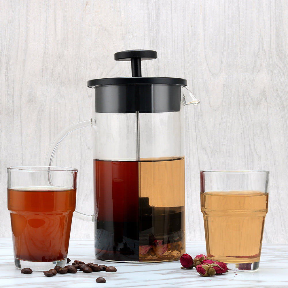 Steep glass tea press pouring