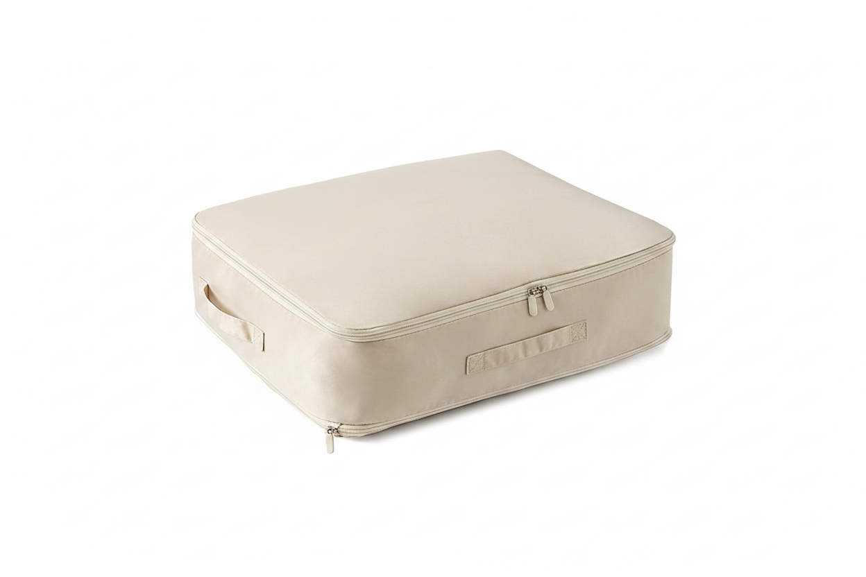 Beige Loft storage bag closed, showing the zip lid and two padded carry handles
