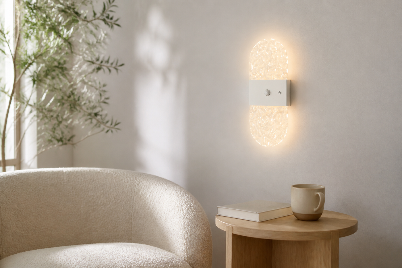 White oval Facet motion-sensor wall light in a bright modern reading nook