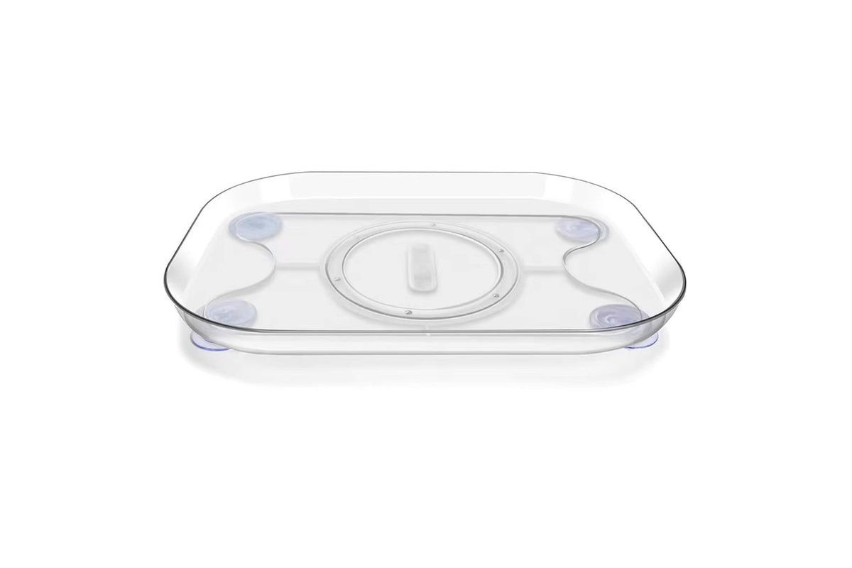 FridgeGlide supplier photograph showing the empty clear tray, rounded corners and four suction cups
