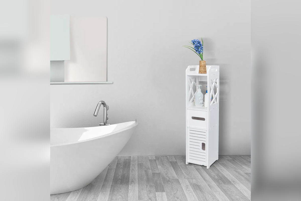 HavenTall slim white storage tower beside a bathtub in a bright bathroom
