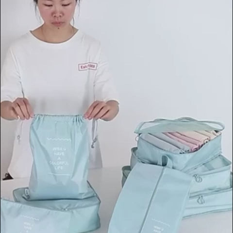 Voyage eight-piece aqua packing organizers demonstrated for clothing, shoes, laundry, toiletries, and small accessories