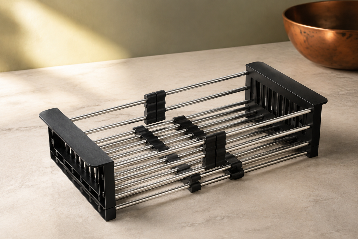 Black expandable sink basket with stainless steel rods