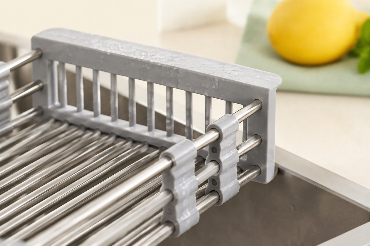 Detail of gray sink basket end support and rod connectors