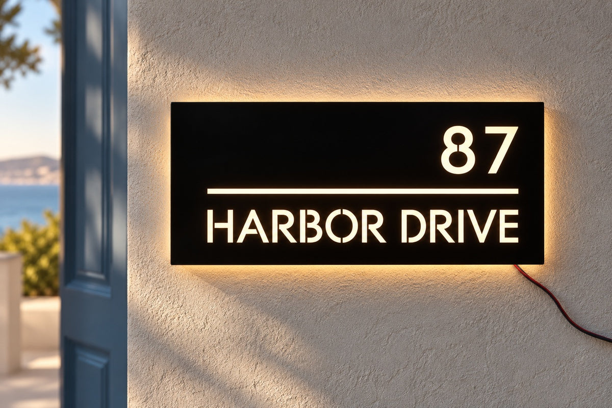 PortGlow address sign — 87 Harbor Drive, frontal detail on plaster; AI-assisted illustrative address, source-reference based